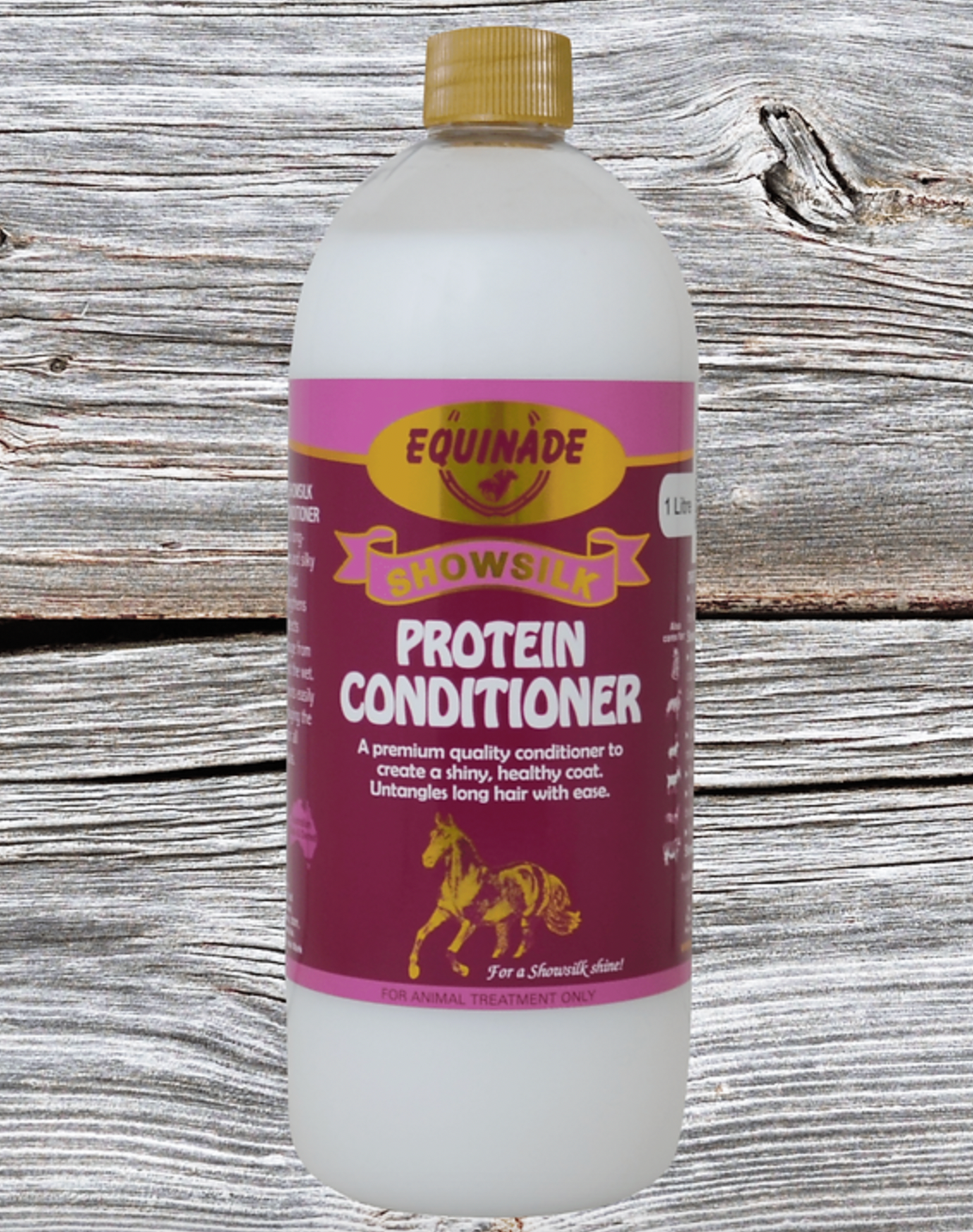 Bottle of Equinade Snowsuit Protein Conditioner on a wooden background