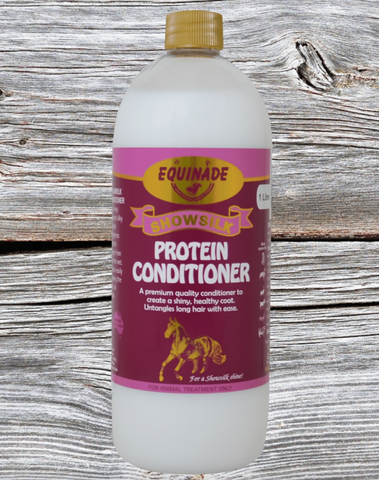 Bottle of Equinade Snowsuit Protein Conditioner on a wooden background